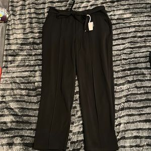 Black work pants with a front tie